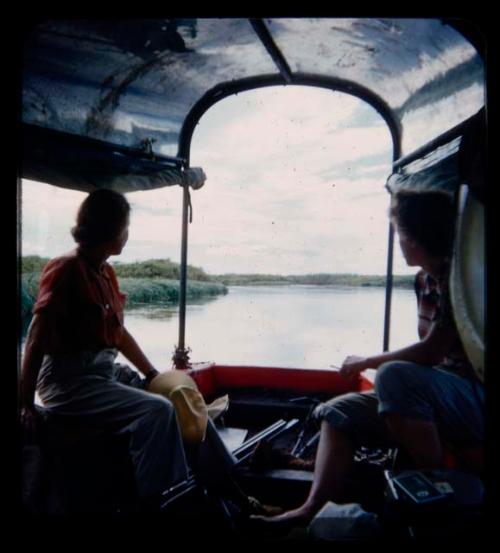 Elizabeth Marshall Thomas and Lorna Marshall on a boat on the Kavango River