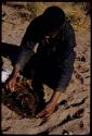 Philip Hameva holding cooked springbok joint, close-up