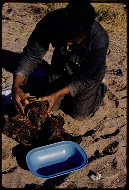 Philip Hameva holding cooked springbok joint