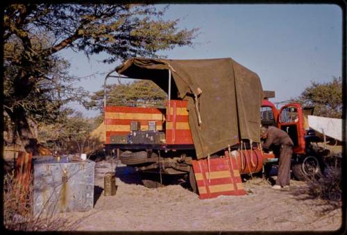 Heinrich Neumann reaching into expedition Dodge truck cab