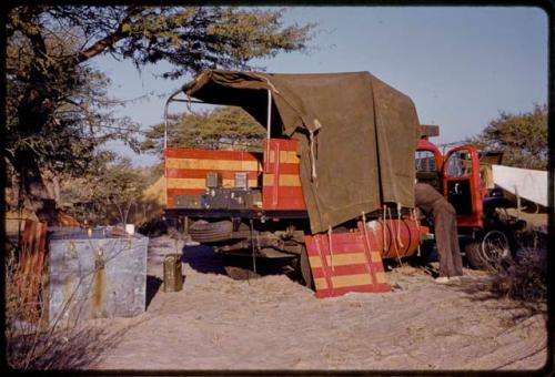 Heinrich Neumann reaching into expedition Dodge truck cab