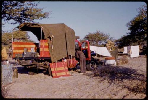 Heinrich Neumann reaching into expedition Dodge truck cab