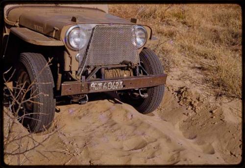 Expedition Jeep front wheels in sand