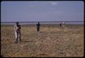 Lorna Marshall, Elizabeth Marshall Thomas, and expedition members walking near a lake