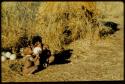 Children, Eating: N!ai giving a drink of water from an ostrich eggshell to /Gaishay, her half-brother