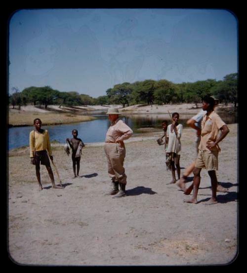 People standing with J. Otis Brew next to the Thamalakane River