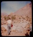 People walking on Brandberg Mountain, view from behind