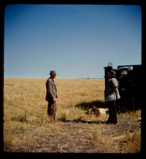 Senator van Zyl and Mr. Mahan standing next to an expedition truck