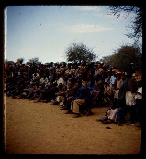 Omajetti indaba, large group of men and boys sitting and standing