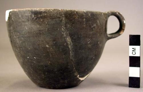 Undecorated pottery cup - one handle