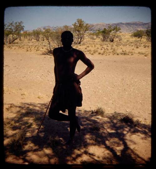 Man standing in the shade of a tree