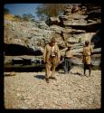 Two men standing with Merl La Voy next to a spring