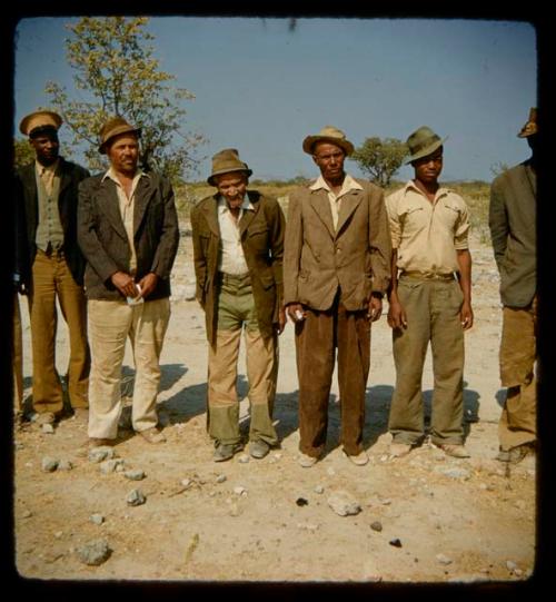 Edward and William Hartley standing with a group of men