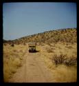 Expedition truck, with a hill in the background