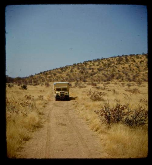 Expedition truck, with a hill in the background