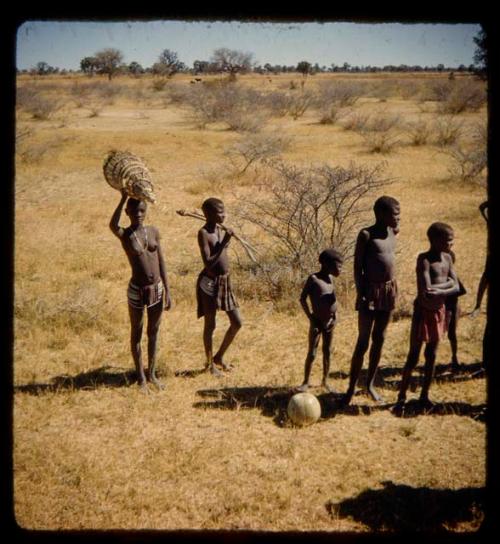 Group of men and boys carrying fishing gear