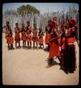 Some of Nehemiah's wives and children standing in a line