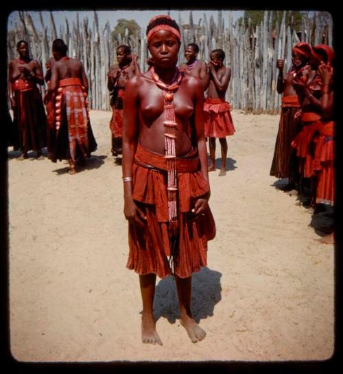 One of Nehemiah's wives standing, with other wives standing around her