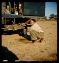 Heinrich Neumann getting water from an expedition truck for breakfast