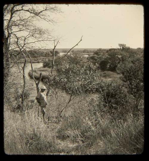 Expedition member standing, with the Kavango River in the background