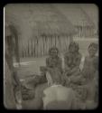 Group of women sitting inside a kraal