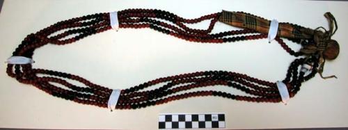 Sioux necklace. 4 strands of red trade beads and black faceted beads strung on b