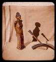 Figurine of a woman and a pipe made from an animal horn