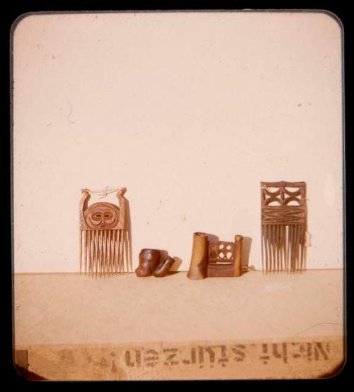 Two carved combs and two other items