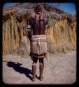 Married woman standing, view from behind