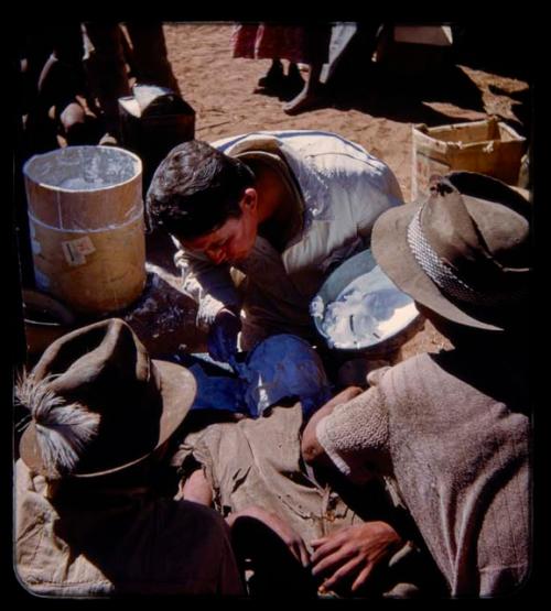 Person having their face cast made by Eric Williams and another expedition member