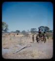 Groups, play: Group of children playing on an anthill