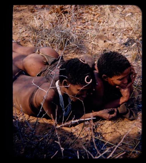 "Young Men": Two young men lying on the ground