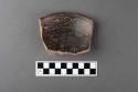 Part of a black incised (in) ring based pottery bowl - Type IIa