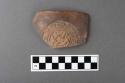 Rim potsherd with stamped design - Type VI