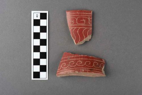 Red polished incised potsherds