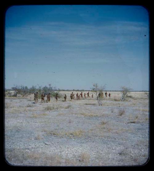 Walking: Group of people walking in single file