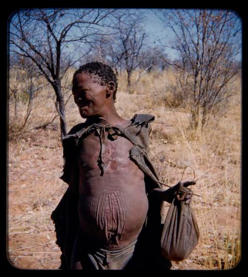 Water: Man standing and holding a bag, close-up