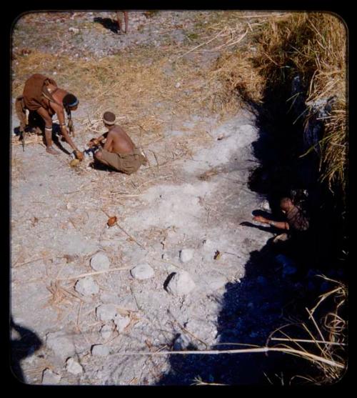 Waterhole: People at a waterhole