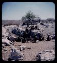 Waterhole: Group of people sitting at a waterhole