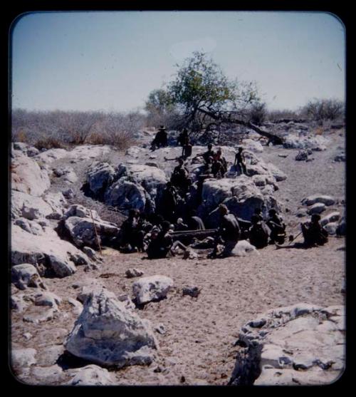 Waterhole: Group of people sitting at a waterhole