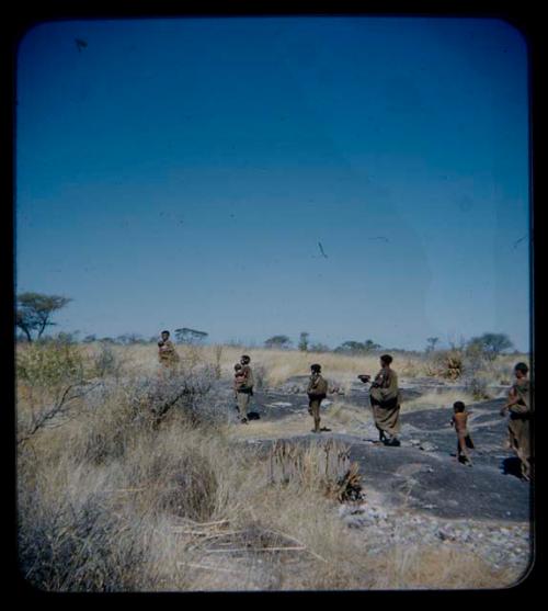 Water: Group of women and children walking, returning from pan