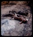 "Young Men": Three boys lying asleep on the ground