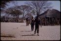 Men walking from a village