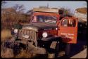 Expedition red Dodge stuck on the side of a road