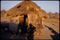 Girls outside a hut