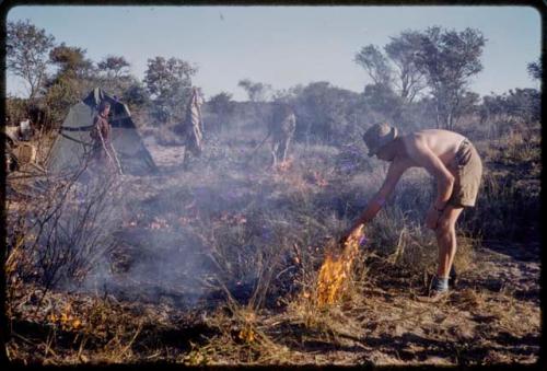 Expedition members setting a back fire