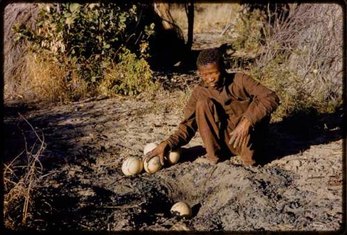 /Gishay with a cache of ostrich egg shells