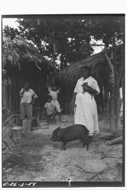 Maya Woman with Full Grown Peccary and Young in Arms