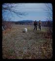 Lorna Marshall standing with another woman and a dog in a field