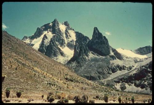 Hill, with a mountain in the background